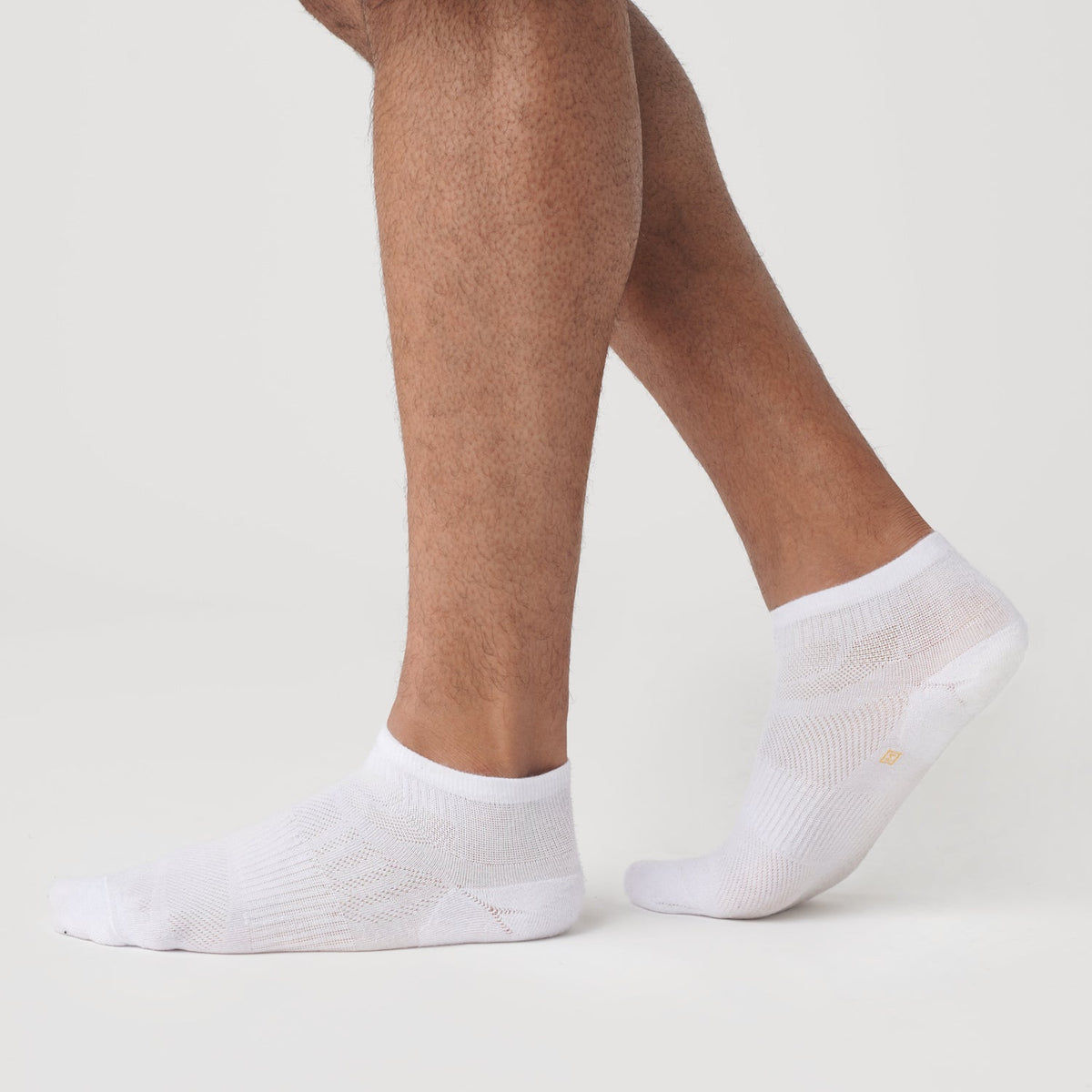 White Ankle Socks 6-Pack on feet, seamless toe detail.