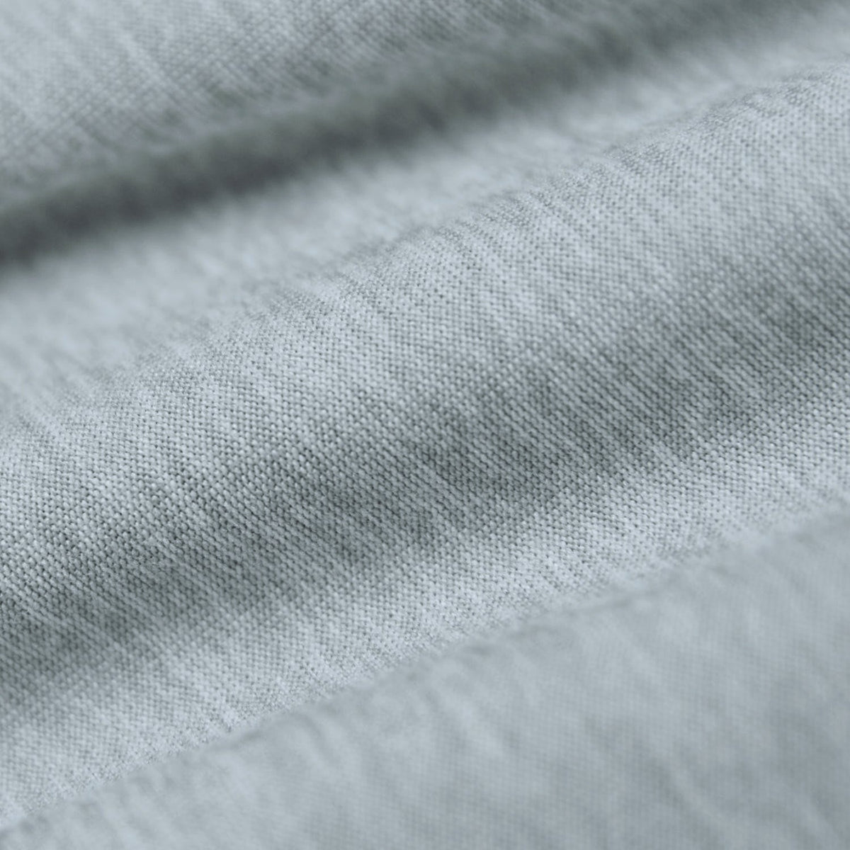 Heather Light Gray Active Polo fabric close-up showing fine knit pattern.