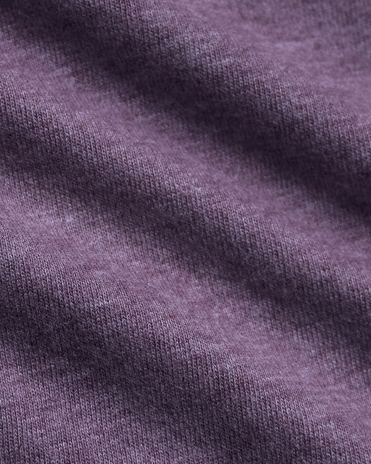 Dark Heather Plum Classic V-Neck showcasing soft knit texture and gentle drape.