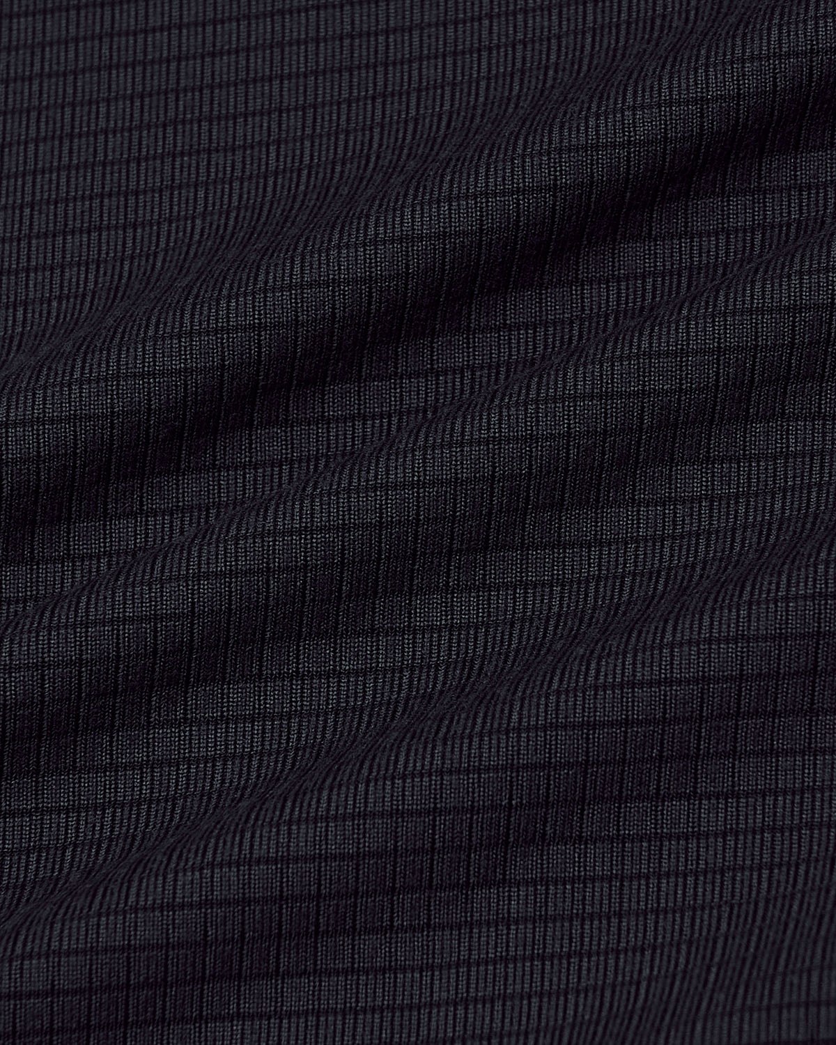 Black Long Sleeve Active Mesh Crew with ripstop texture and gentle fabric folds.