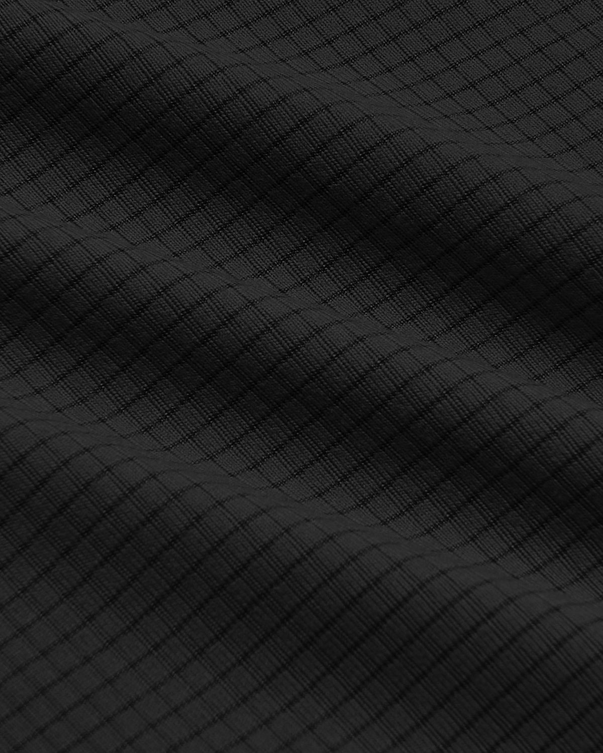 Black Sleeveless Active Mesh Tank showing grid-textured fabric weave.