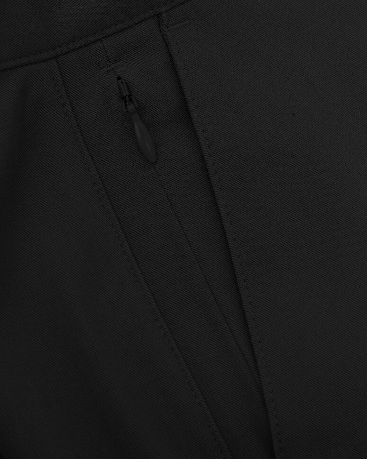 Black Slim Twill Chino Pant's zipper on black twill fabric.