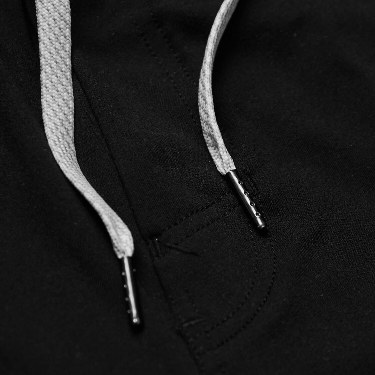 Black Active Comfort Shorts, featuring light grey drawcords with metal aglets.