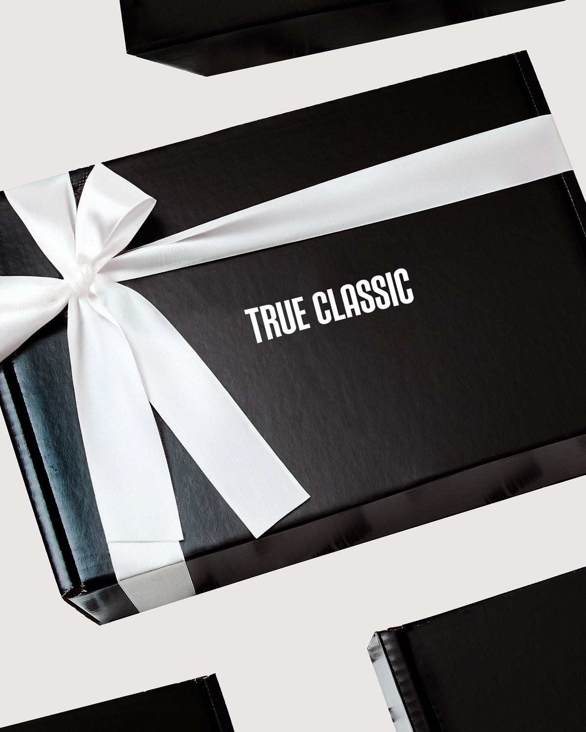 Gift Box with True Classictees text and white satin ribbon.