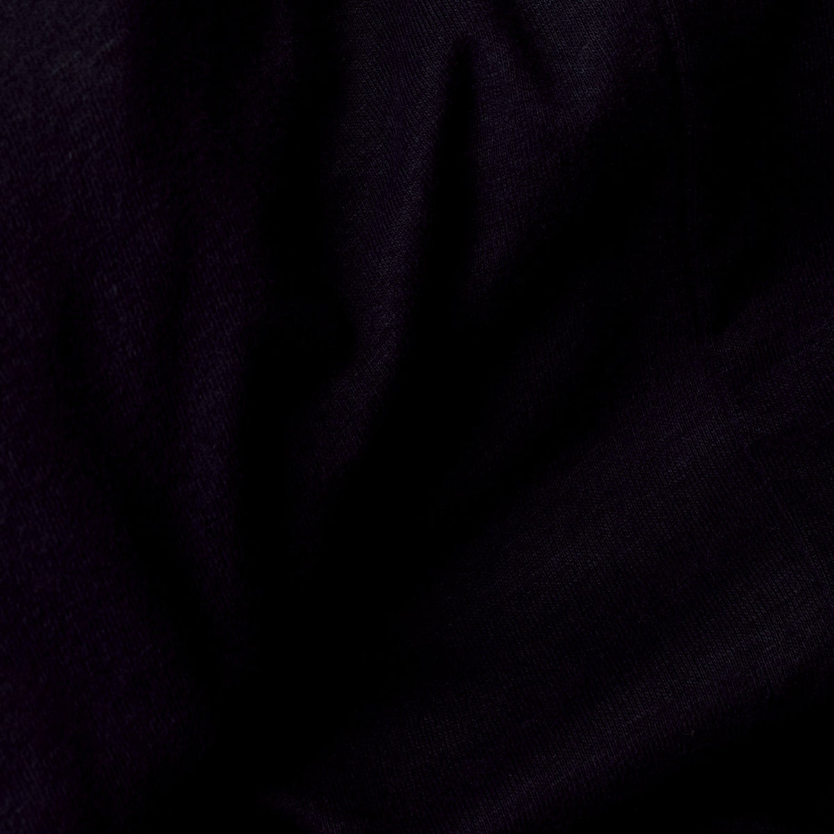Black V Neck Tee with soft folds and fine weave texture.