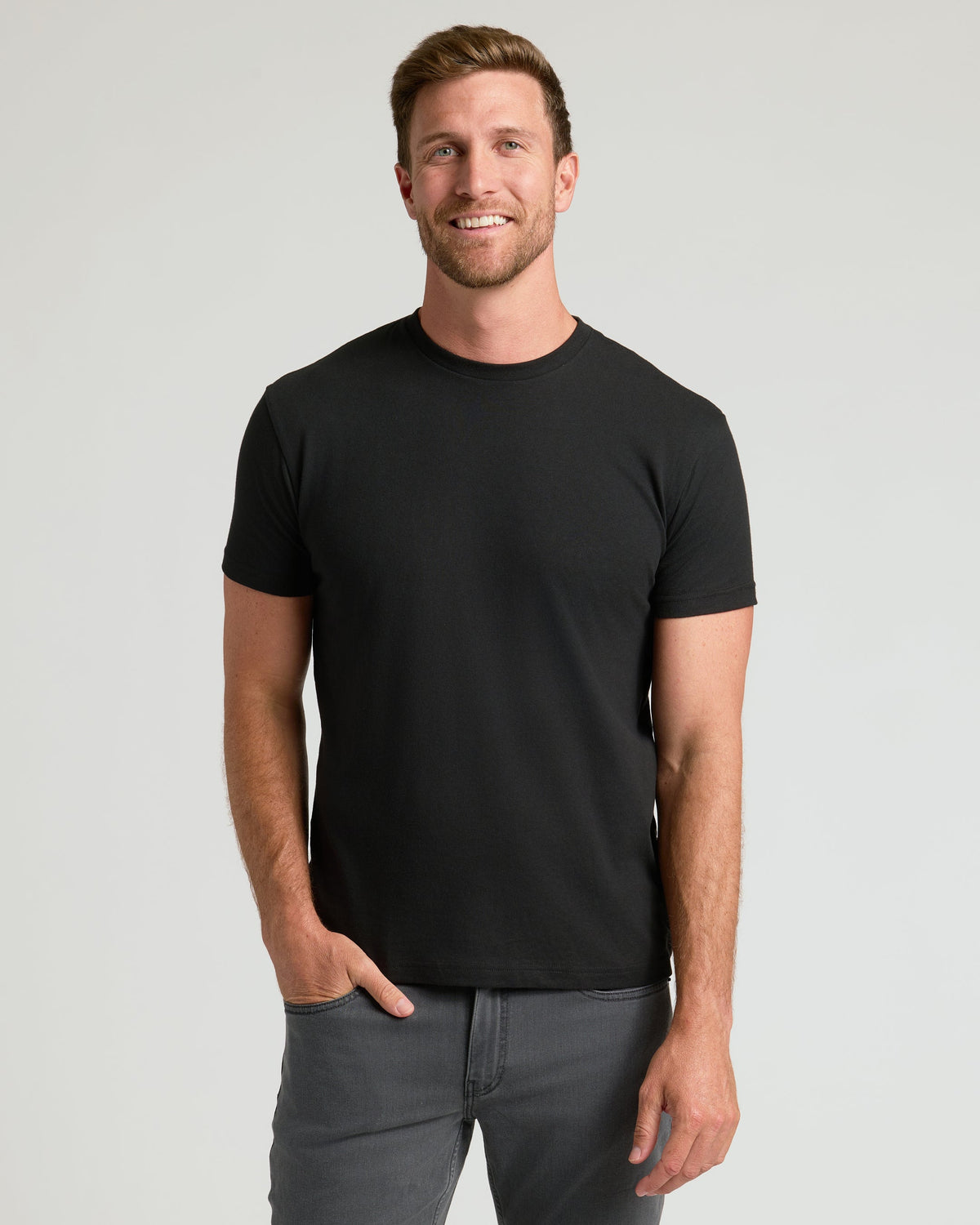 Man modeling CombinedListingTest Classic Crew Neck and gray pants.