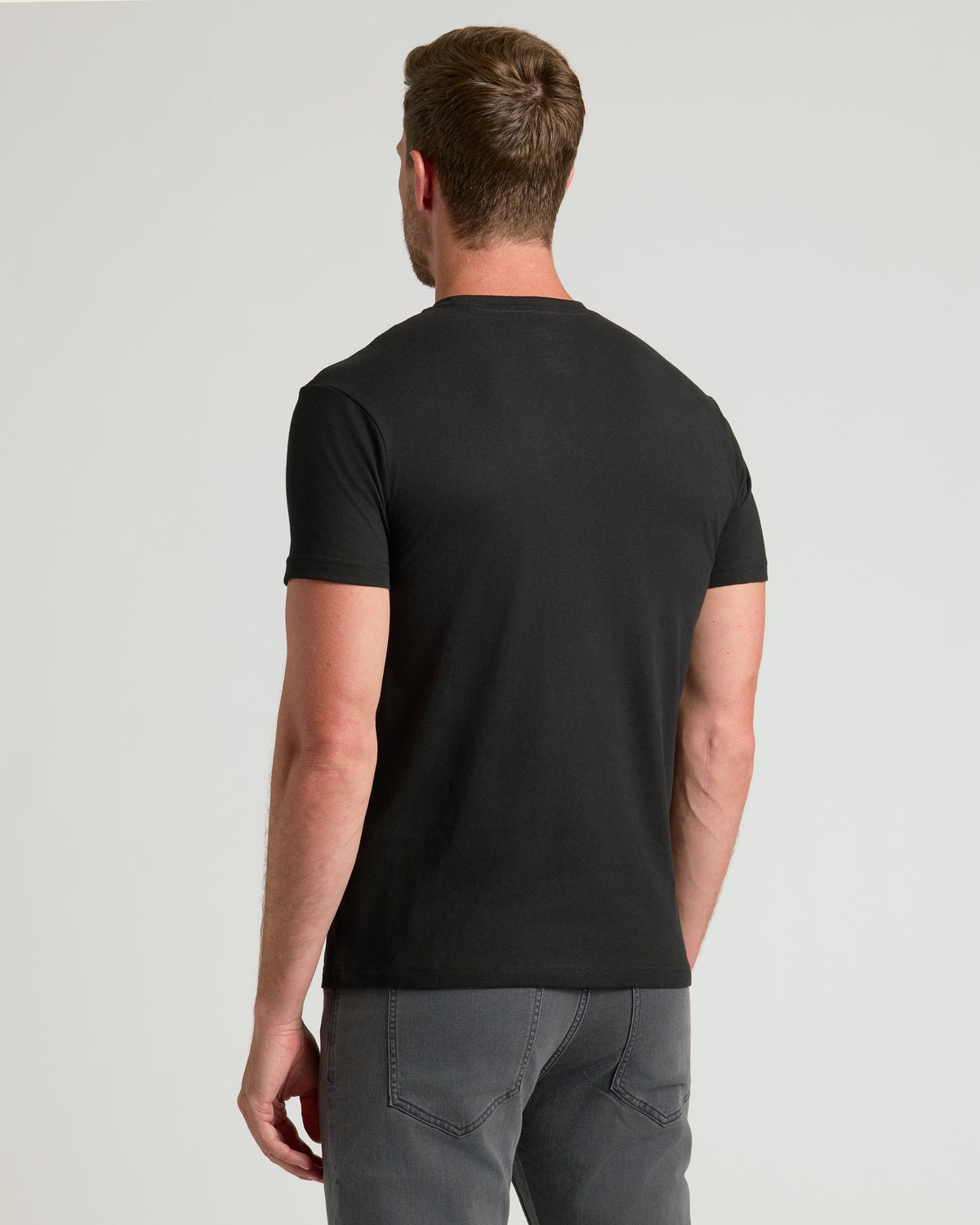 Black short-sleeve crew neck T-shirt, back view.