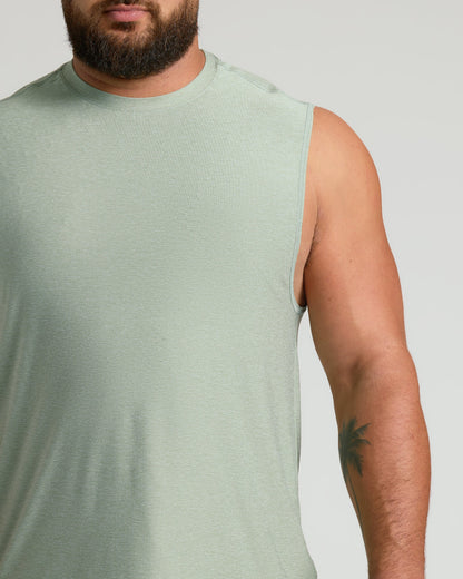 Lichen Sleeveless Active Muscle Tee on man with palm-tree tattoo.